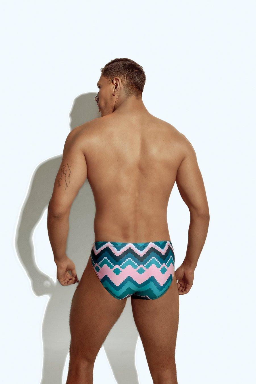 Men's chevron print swim brief in teal and pink, stylish and bold design for gay men, perfect for beach or pool wear