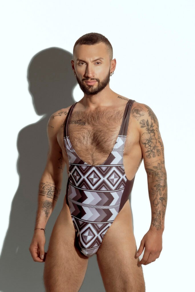 Men's tribal print swim bodysuit with high-cut design, ideal for gay men seeking unique and bold swimwear