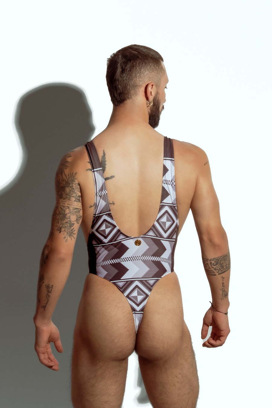 Men's tribal print swim bodysuit with high-cut design, ideal for gay men seeking unique and bold swimwear