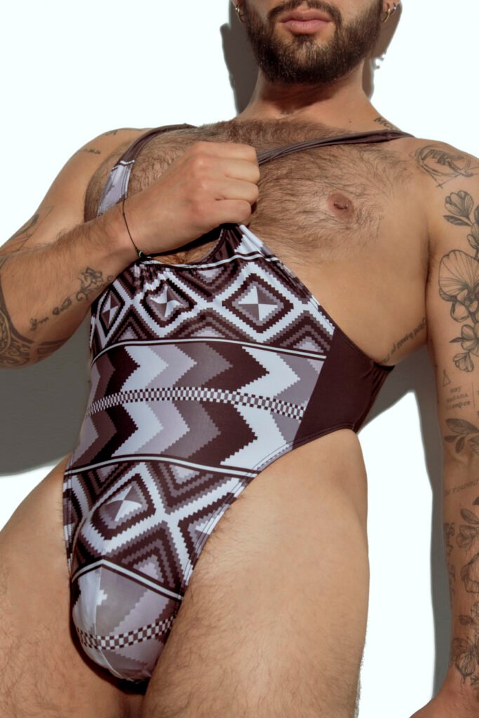 Men's tribal print swim bodysuit with high-cut design, ideal for gay men seeking unique and bold swimwear