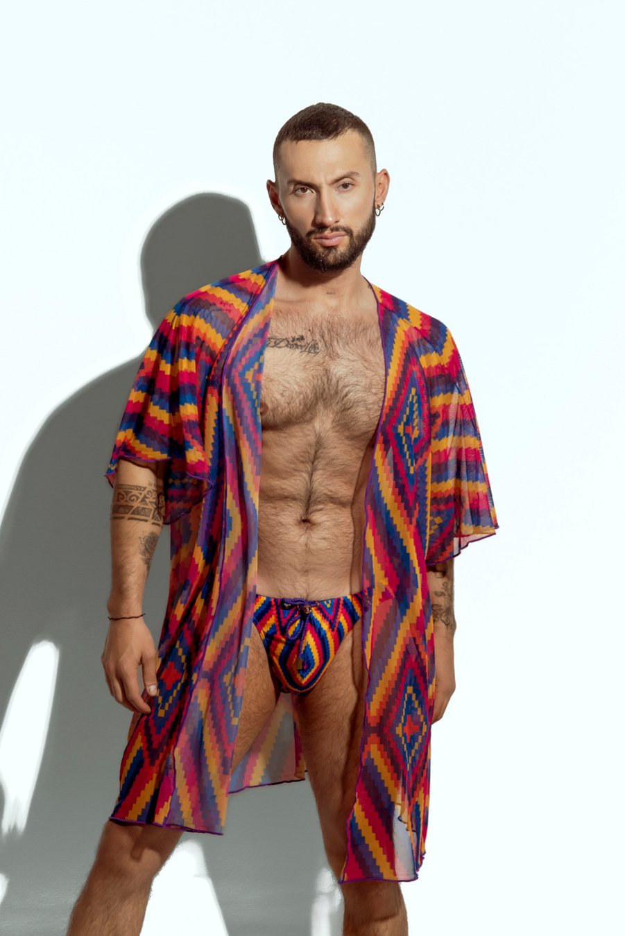 Men's sheer geometric cover-up, perfect for stylish beachwear or poolside fashion, designed for gay men who embrace bold, unique looks