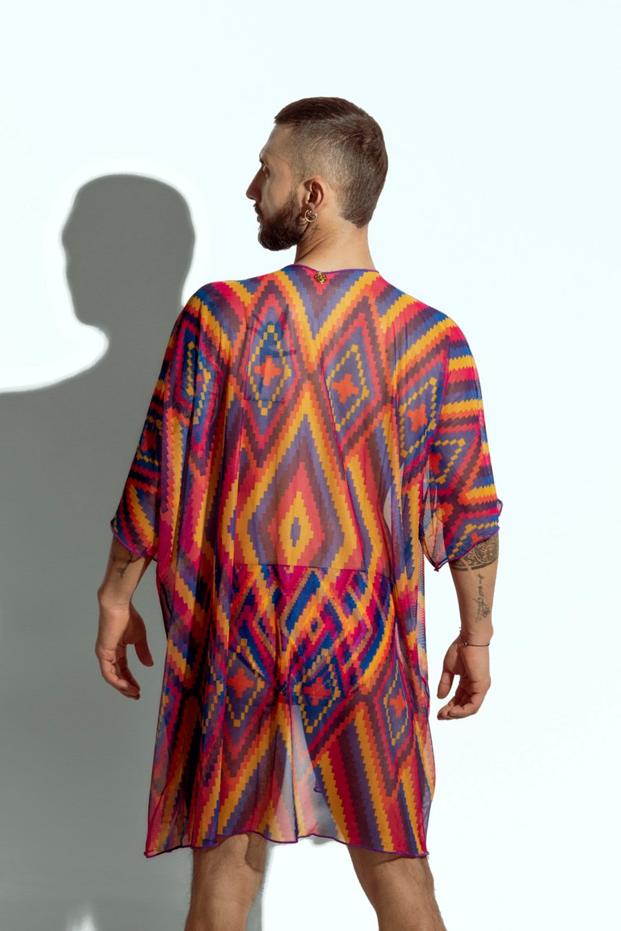 Men's sheer geometric cover-up, perfect for stylish beachwear or poolside fashion, designed for gay men who embrace bold, unique looks