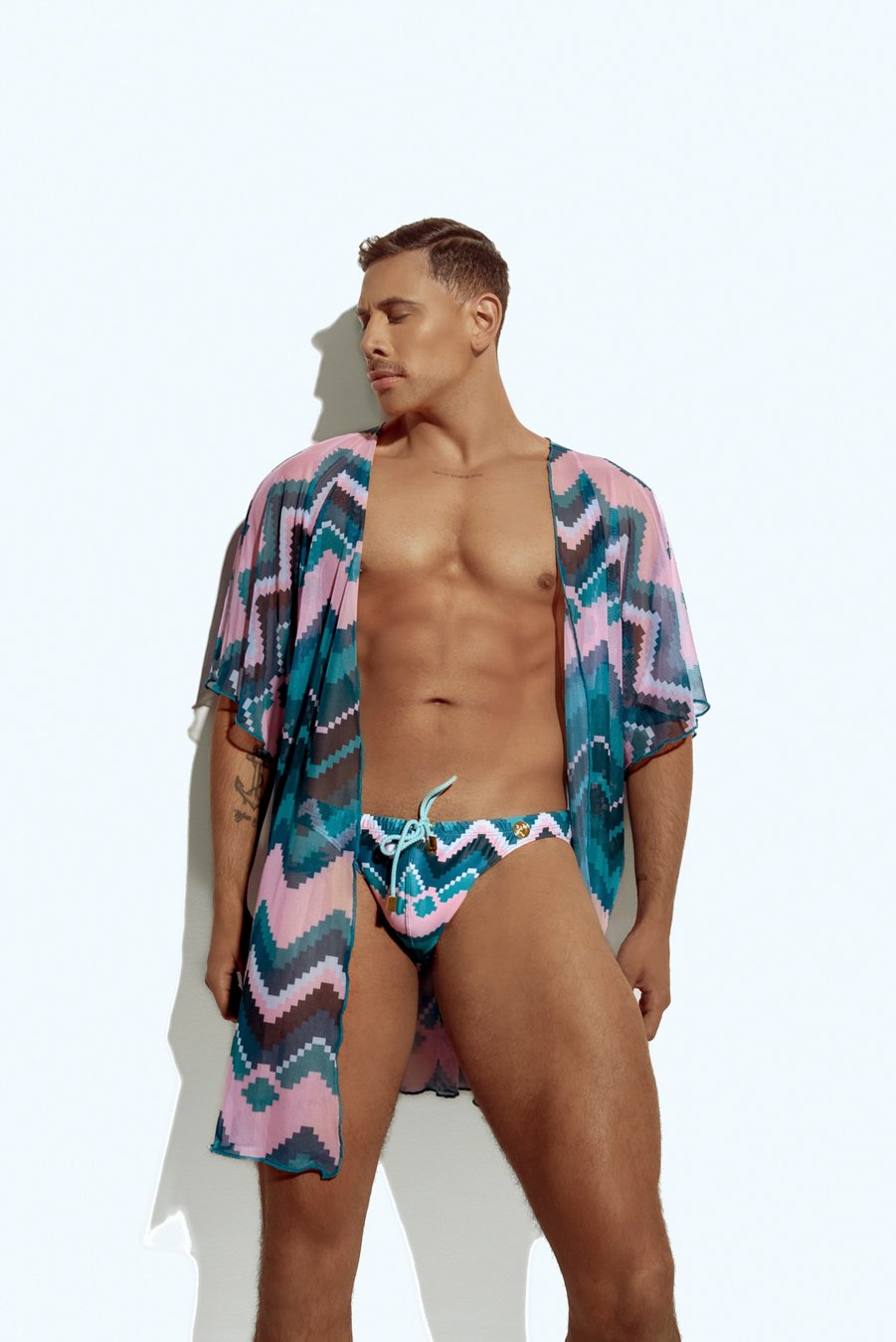 Men's sheer geometric cover-up, perfect for stylish beachwear or poolside fashion, designed for gay men who embrace bold, unique looks