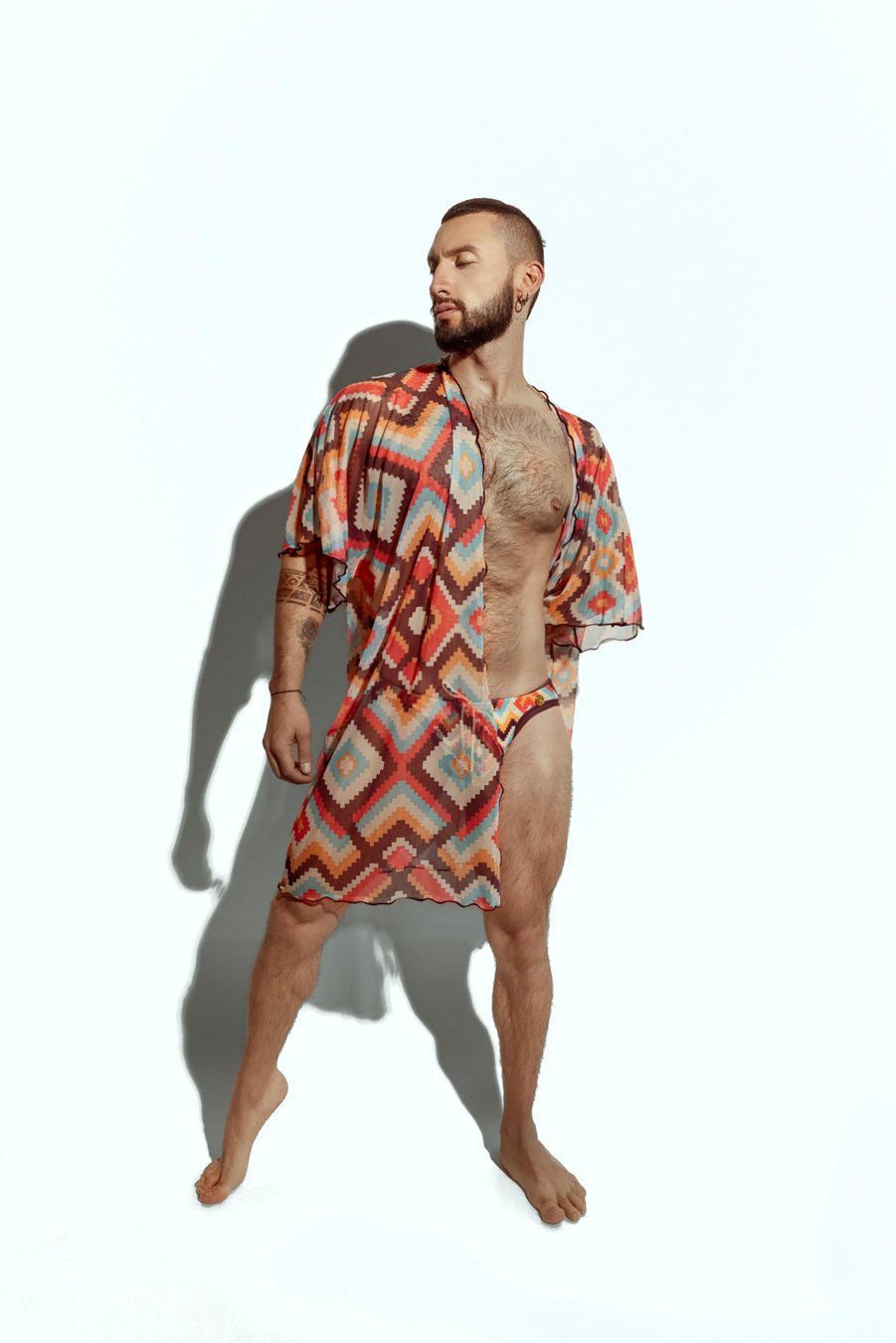 Men's sheer geometric cover-up, perfect for stylish beachwear or poolside fashion, designed for gay men who embrace bold, unique looks