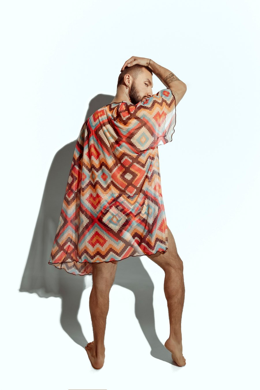 Men's sheer geometric cover-up, perfect for stylish beachwear or poolside fashion, designed for gay men who embrace bold, unique looks