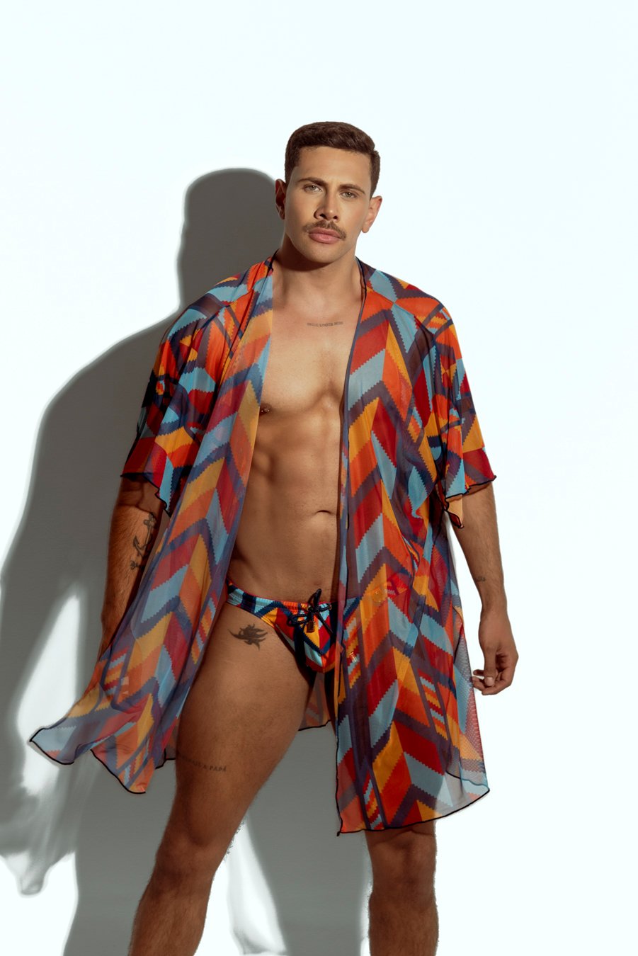 Men's sheer geometric cover-up, perfect for stylish beachwear or poolside fashion, designed for gay men who embrace bold, unique looks