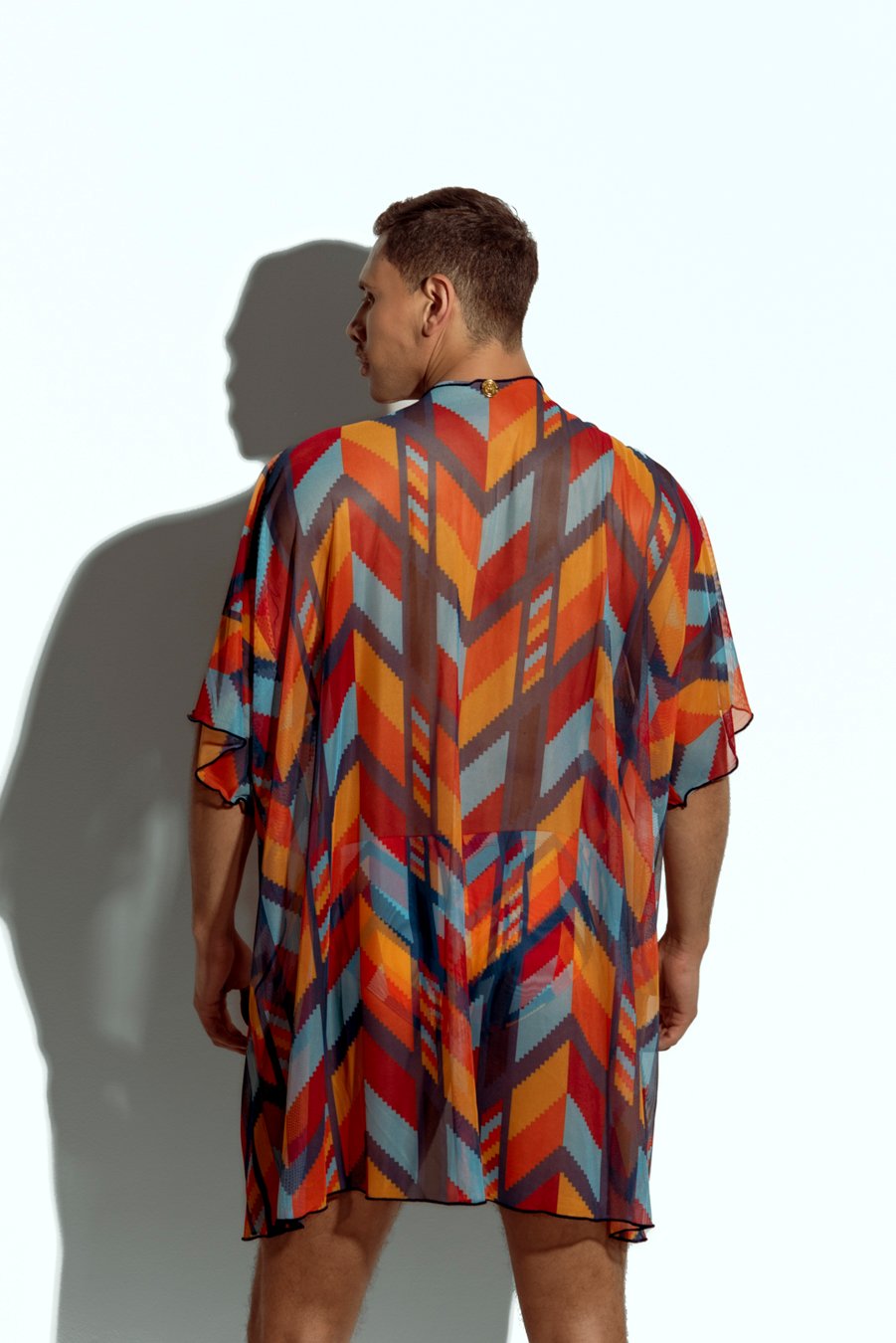 Men's sheer geometric cover-up, perfect for stylish beachwear or poolside fashion, designed for gay men who embrace bold, unique looks