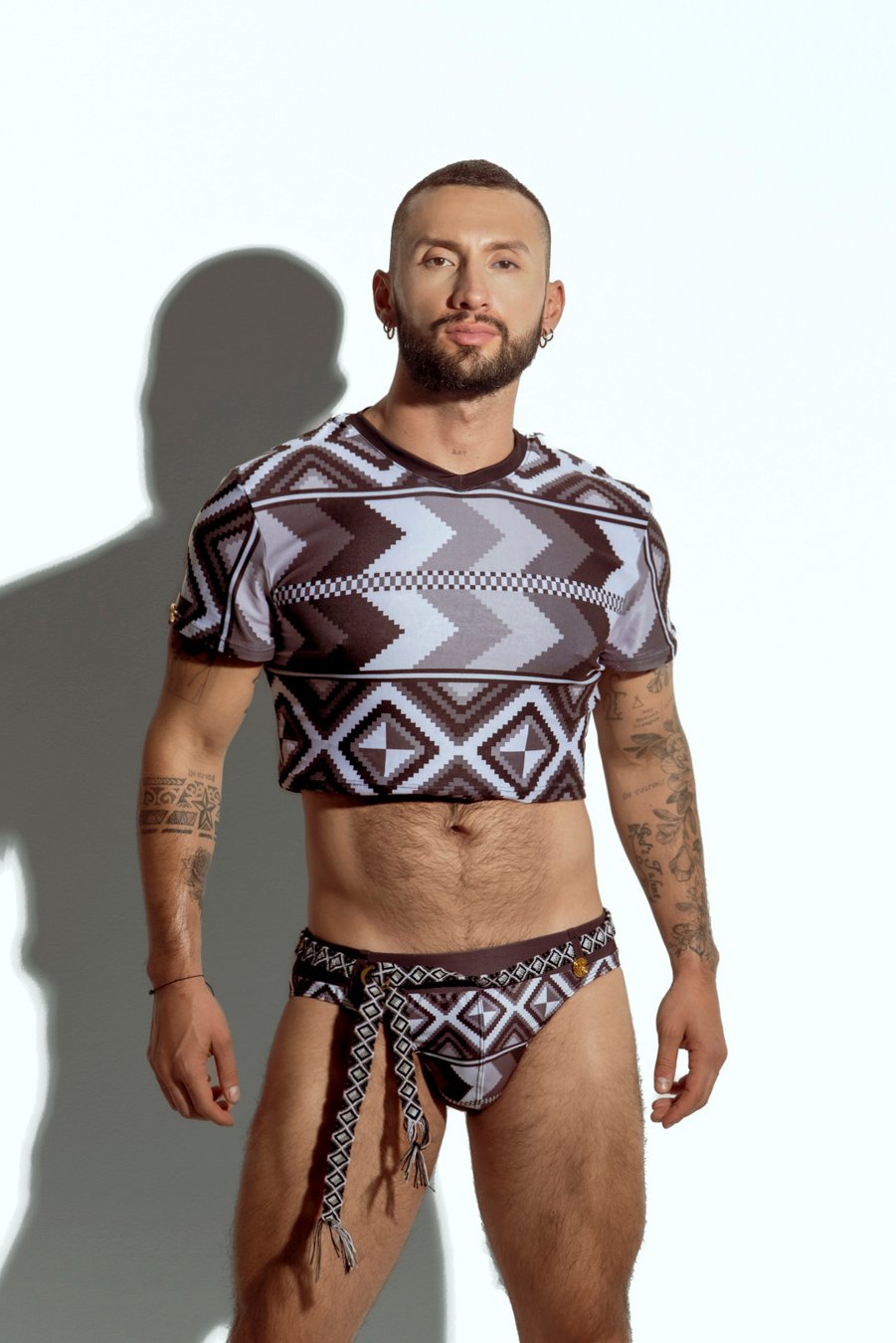 Men's crop top with bold geometric patterns, perfect for fashion-forward gay men seeking unique, trendsetting apparel