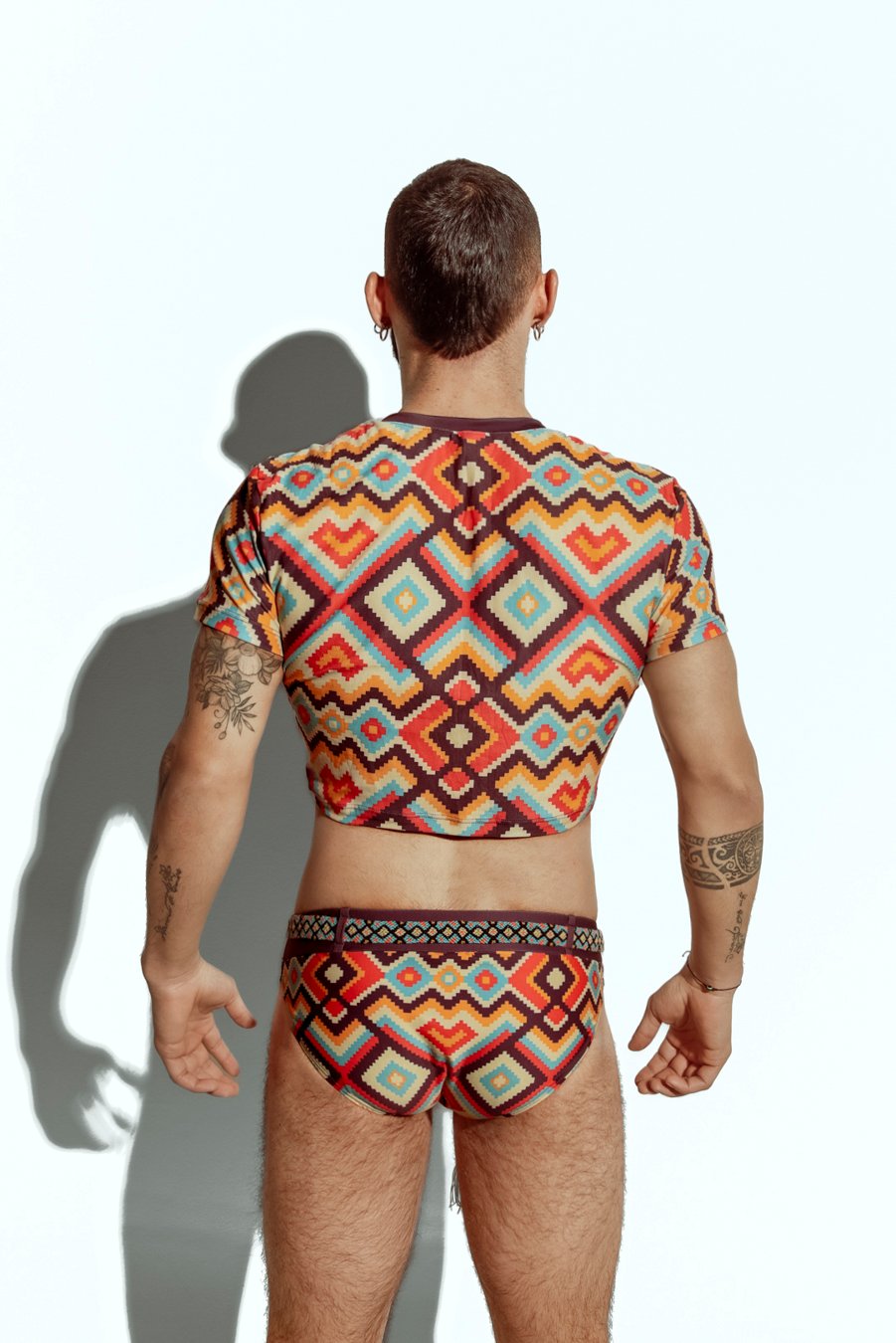 Men's crop top with bold geometric patterns, perfect for fashion-forward gay men seeking unique, trendsetting apparel