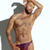 Men's swim thong with vibrant rainbow stripe pattern, designed for gay men looking for bold and colorful beachwear