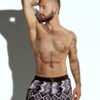 Men's swim short with tribal geometric print in neutral tones, designed for gay men seeking bold and sexy swimwear